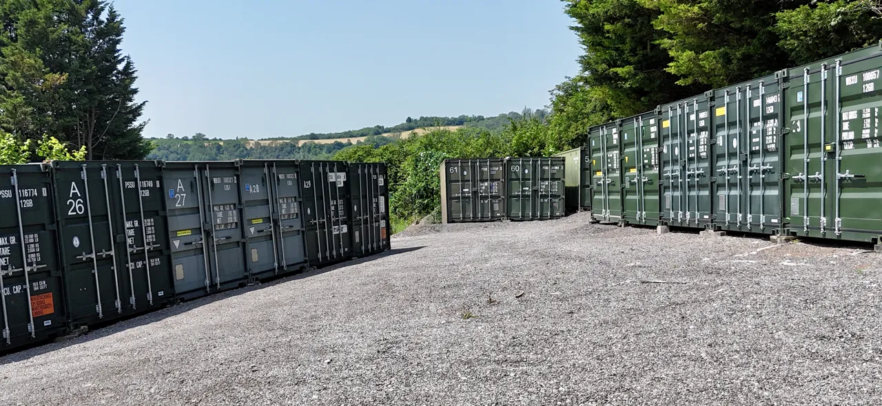 Neat rows of storage containers with the hills of the Bath countryside beyond